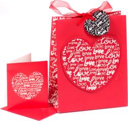 Rote Geschenktüte mit Herzmotiv. Dazu eine passende Karte im gleichen Design.