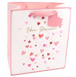 Geschenktüte in Rosa und Weiß. Verziert mit Herzen in verschiedenen Farben. Goldene Schrift 'Von Herzen'.