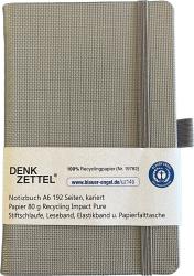 Graues Notizbuch im A6-Format. 192 karierte Seiten aus 100% Recyclingpapier.