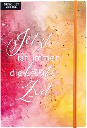Notizbuch mit buntem Aquarell-Hintergrund. Auf dem Cover steht der Text: 'Jetzt ist immer die beste Zeit'.