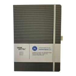 Dunkelgraues Notizbuch mit elastischem Verschluss. 192 karierte Seiten aus 100% Recyclingpapier.