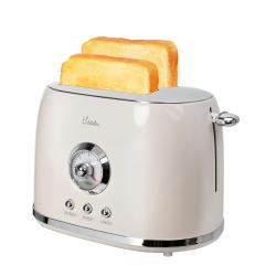 cremefarbener Toaster mit silbernen Akzenten. Runde Zeitanzeige in der Mitte. Drei Tasten: Auftauen, Wiedererwärmen, Abbrechen.