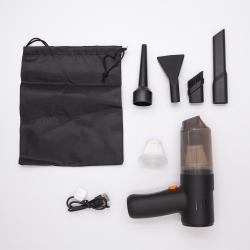 Handstaubsauger in Schwarz mit transparentem Behälter. Ergonomischer Griff und schmaler Aufsatz.