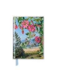 Notizbuch mit buntem Blumenmotiv. Landschaft im Hintergrund.