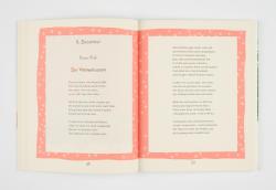 Offenes Buch mit weißen Seiten und rosa Rahmen mit Sternen. Text auf den Seiten ist in deutscher Sprache, Gedicht über den Weihnachtsstern.