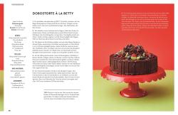 Buchcover mit dem Titel 'BETTY BACKT!'. Eine Frau mit grauen Haaren hält eine Torte auf einem roten Teller.