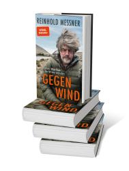 Buchcover mit dem Titel 'Gegen Wind' von Reinhold Messner. Abgebildet ist ein Mann mit grauen Haaren in einem grünen Jacket vor einer Landschaft.
