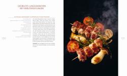 Buchcover mit dem Titel 'WILD'. Enthält 125 Rezepte aus Wald und Flur, abgebildet ist ein Gericht mit Wildfleisch.