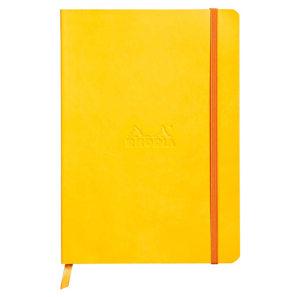 Gelbes Notizbuch mit einem Gummiband. Auf der Vorderseite ist das Wort 'Rhodia' eingeprägt.
