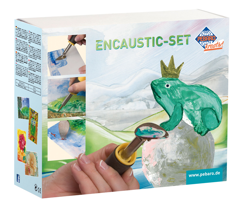 Verpackung eines Encaustic-Sets. Abgebildet sind verschiedene Maltechniken und ein grüner Frosch mit einer Krone.
