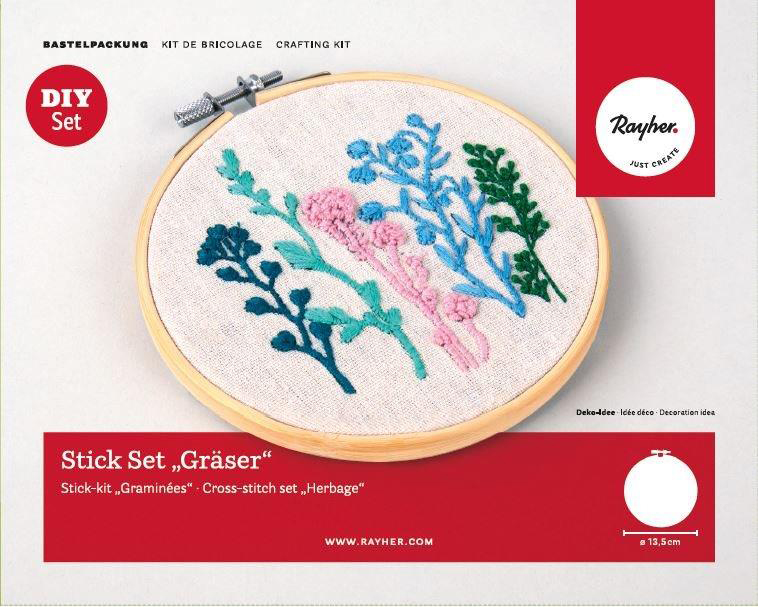 Stickset mit bunten Pflanzenmotiven. Im Stickrahmen, auf hellem Stoff.