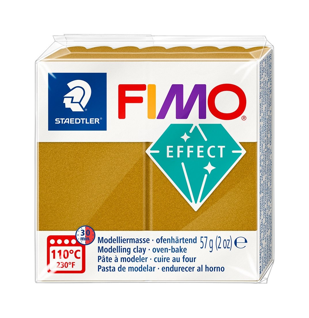 Fimo Modelliermasse in goldener Farbe. Verpackung mit Informationen zur Anwendung.
