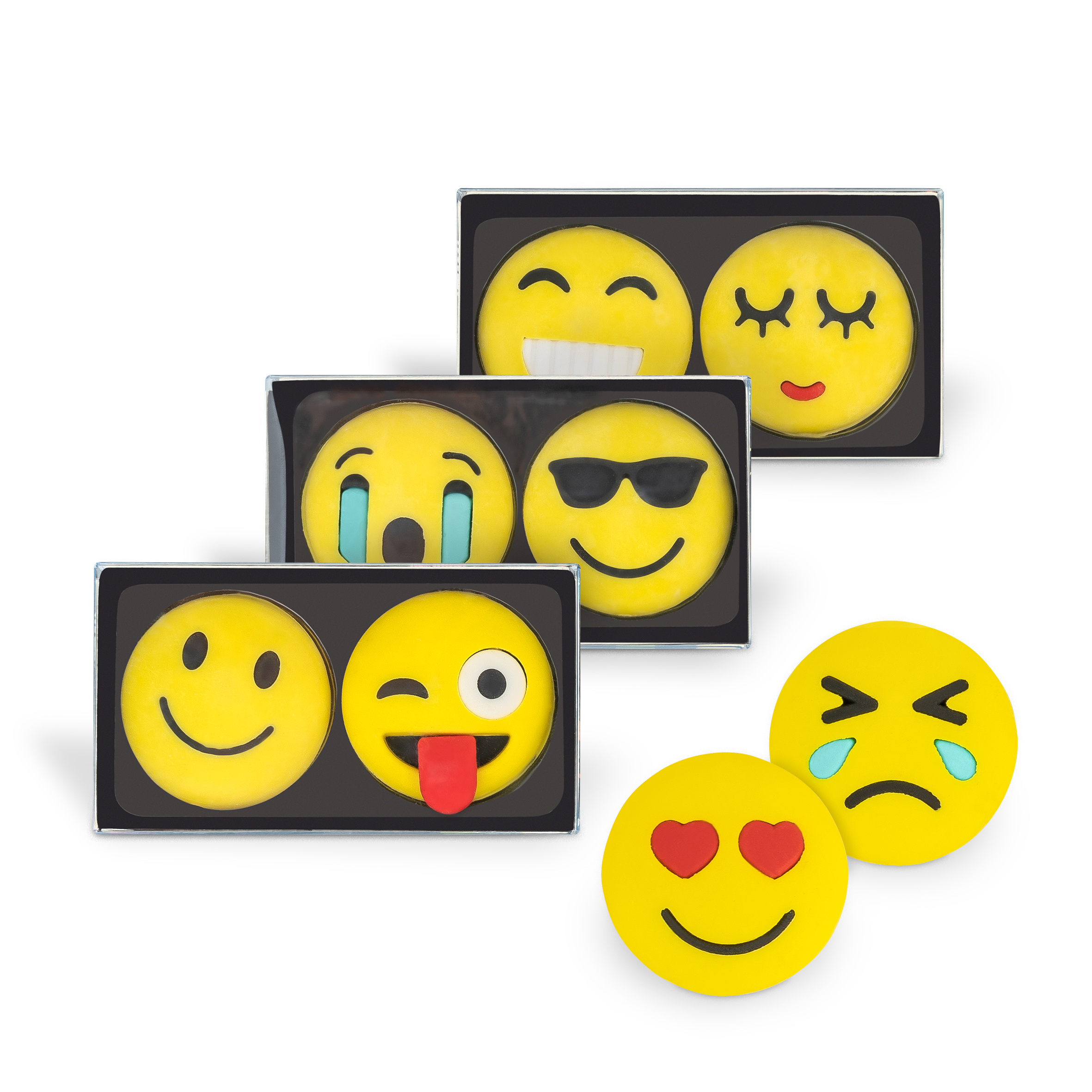 Drei Boxen mit gelben Emoji-Keksen. Verschiedene Gesichtsausdrücke: lächelnd, weinend, cool mit Sonnenbrille, verliebt. Zwei Kekse mit traurigem und fröhlichem Gesicht.