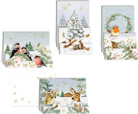 Vier verschiedene Weihnachtskarten mit Tiermotiven. Winterlandschaften mit Vögeln, Rehen und einem Weihnachtsbaum.