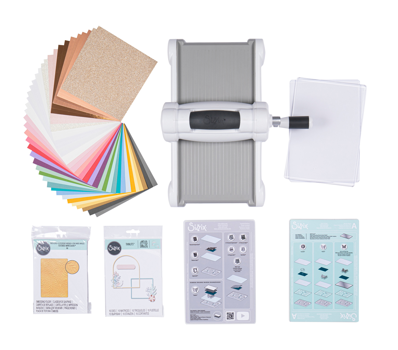 Stanzmaschine mit buntem Papier und Stanzformen. Zubehör für Bastelarbeiten.