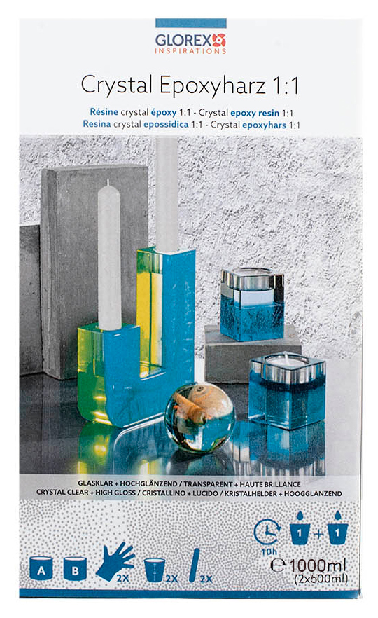 Verpackung für Crystal Epoxyharz 1:1. Zwei transparente Behälter, eine Kerze, eine Glaskugel. Farben: Blau, Gelb, Silber. Hochglänzende Oberfläche.