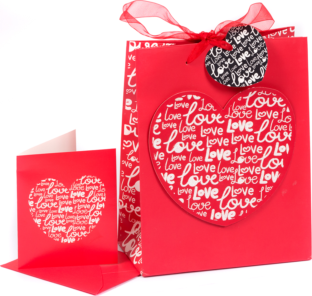Rote Geschenktüte mit Herzmotiv. Dazu eine passende Karte im gleichen Design.