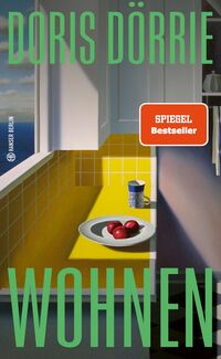 Buchcover von 'Wohnen' von Doris Dörrie. Gelbe Küchenoberfläche mit Äpfeln auf einem Teller.